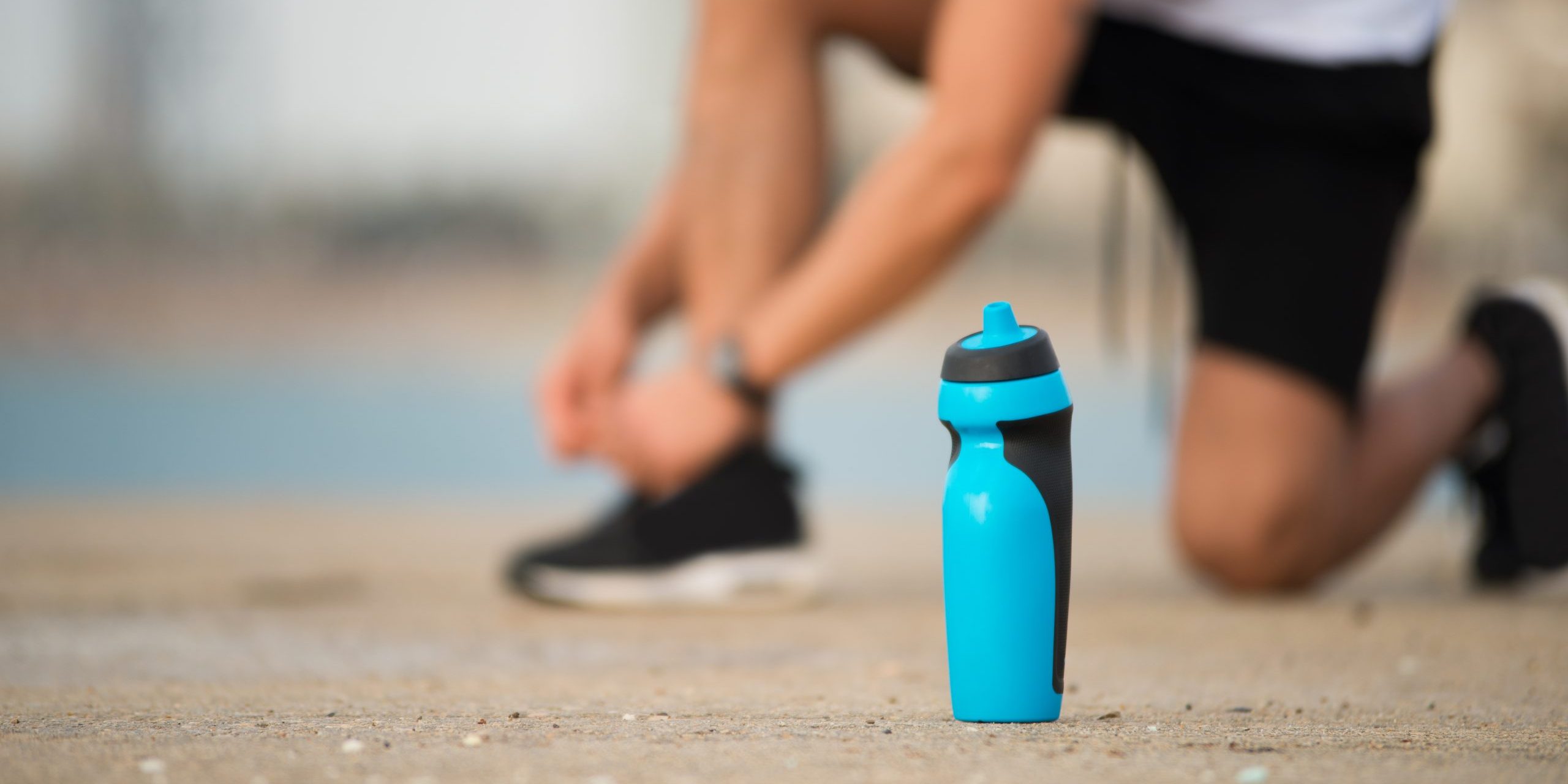 Fitness shaker bottle on ground